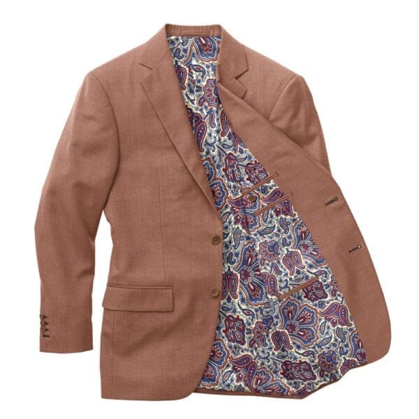 A brown jacket with a paisley lining on it.