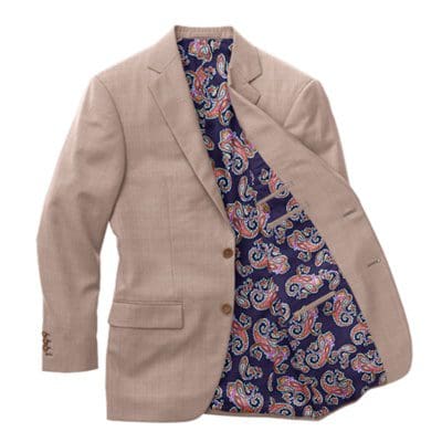 A suit jacket with a blue and white paisley pattern on the inside of it.