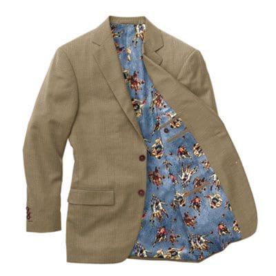 A tan jacket with a blue tie and mickey mouse shirt.