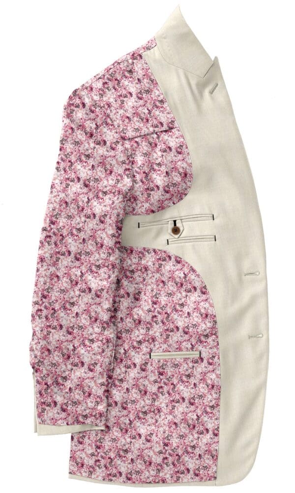 A pink floral print jacket with white trim.