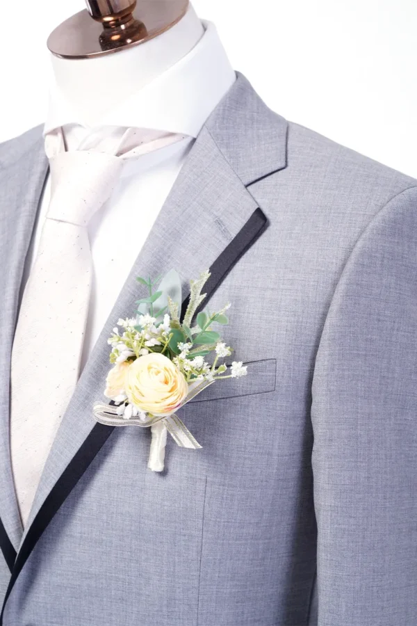 A man in a suit and tie with a flower boutonniere.