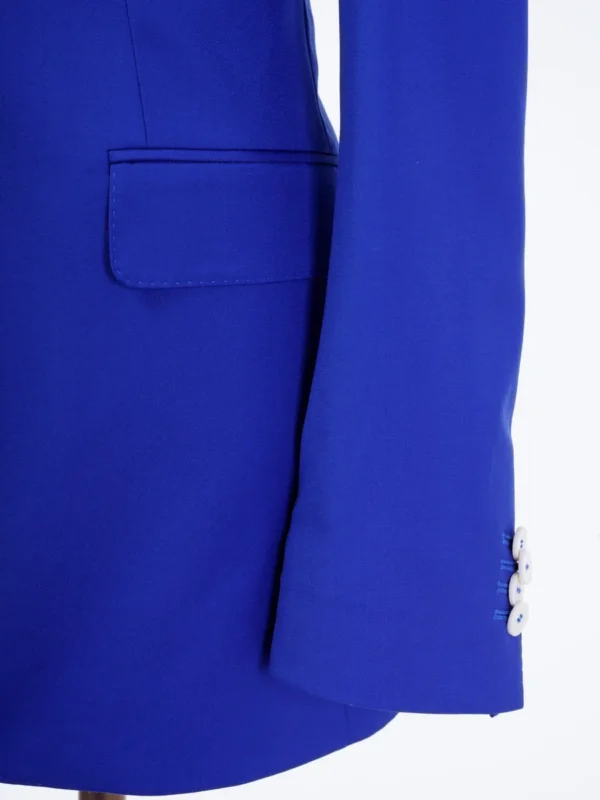 A close up of the sleeve and pocket on a suit