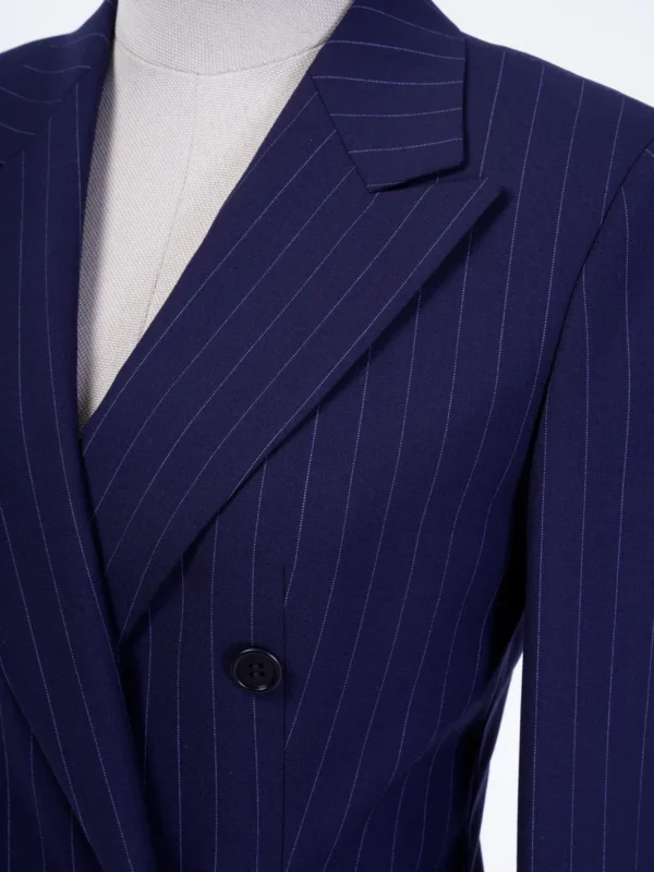 A suit that is blue and has white pinstripes.