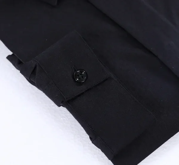 A black shirt with a button up collar and sleeves.