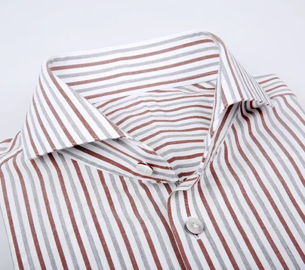 A close up of the collar and sleeve of a shirt