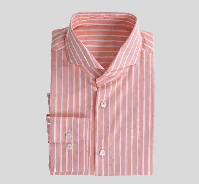 A pink striped shirt is shown on the ground.