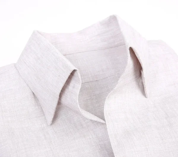 A close up of the collar and cuffs on a white shirt.