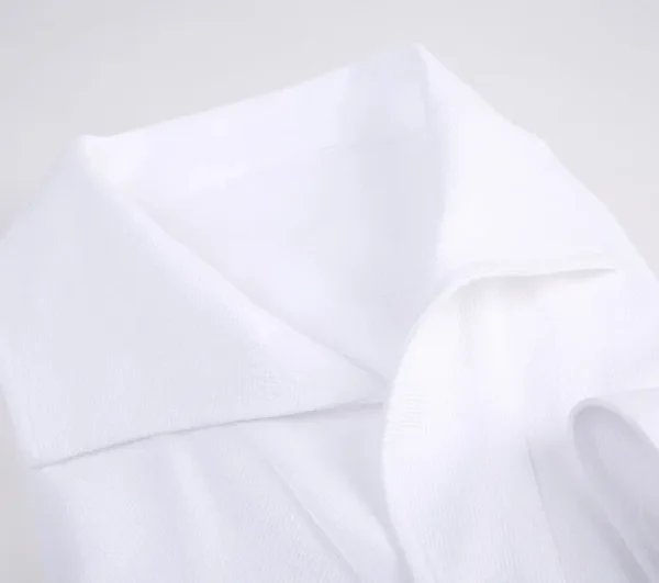 A close up of the corner of a white shirt