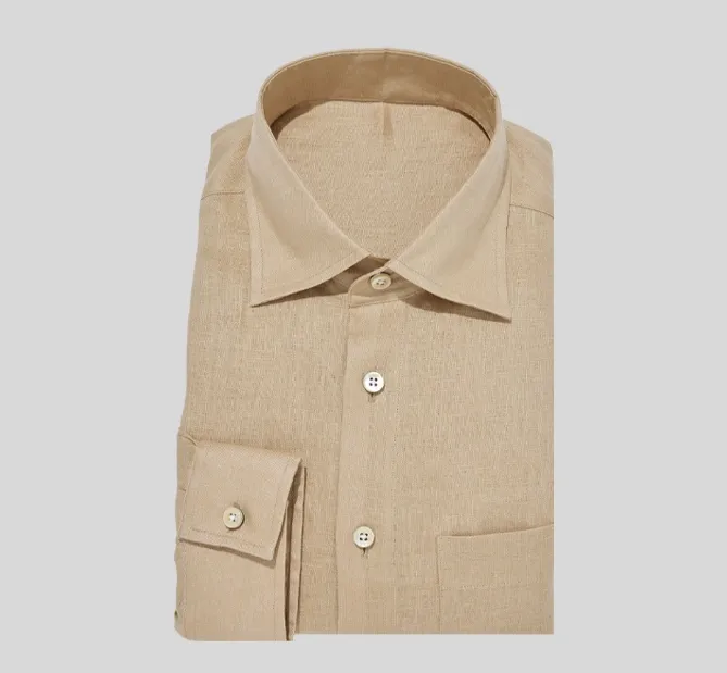 A tan colored shirt with two pockets on the chest.