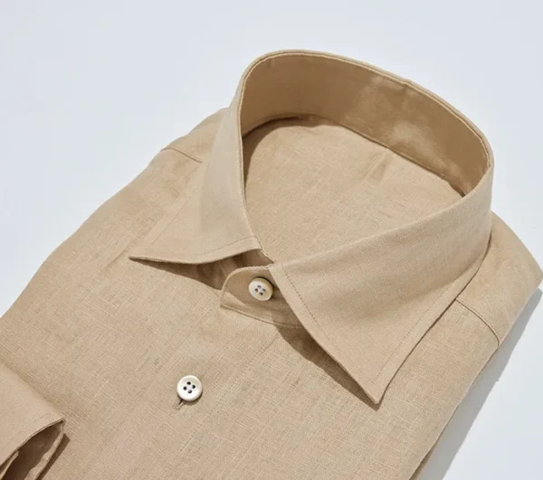 A close up of the collar and cuff on a shirt