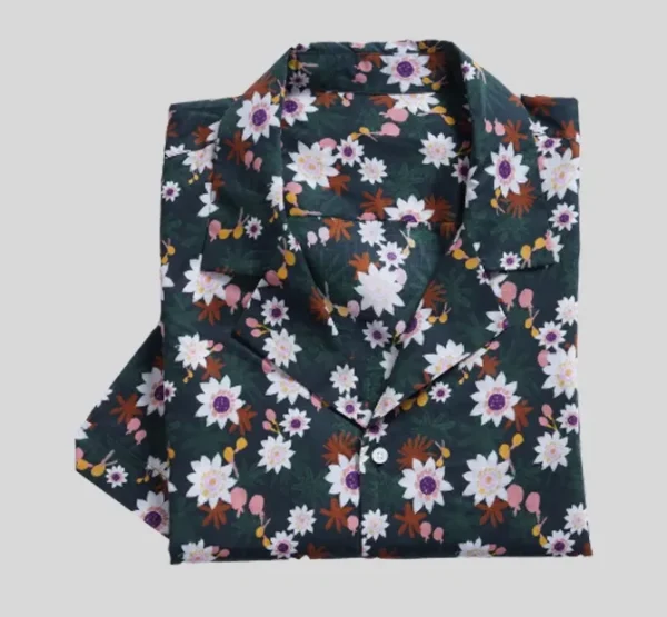 A green shirt with white and purple flowers.