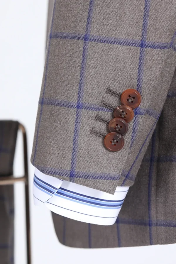 A close up of buttons on the sleeve of a suit