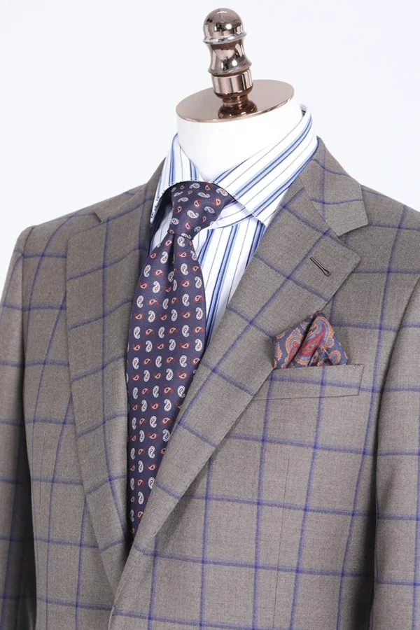 A suit and tie with a pocket square.