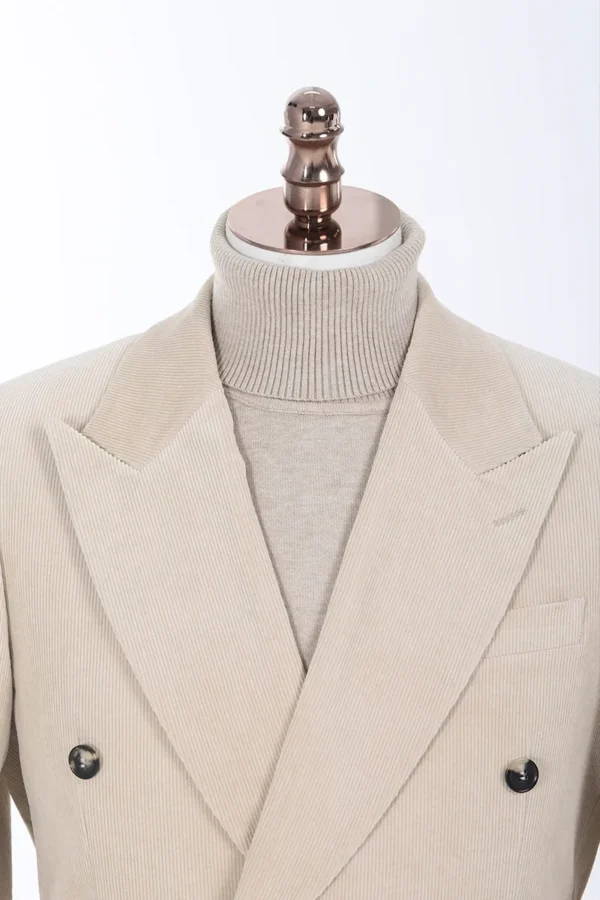 A suit jacket and sweater on display.