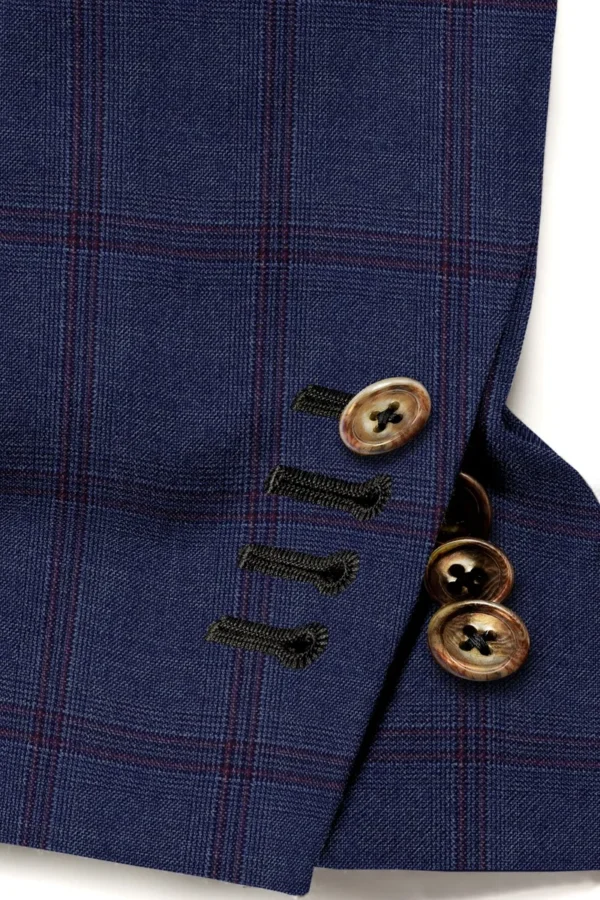 A close up of buttons on a suit jacket