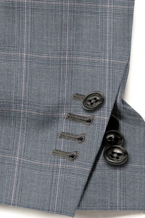 A close up of buttons on a suit jacket