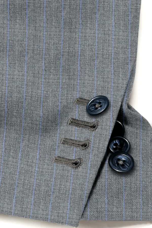 A close up of buttons on a suit jacket