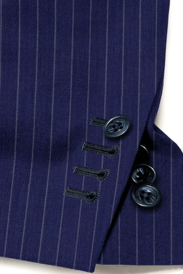 A close up of buttons on a suit jacket