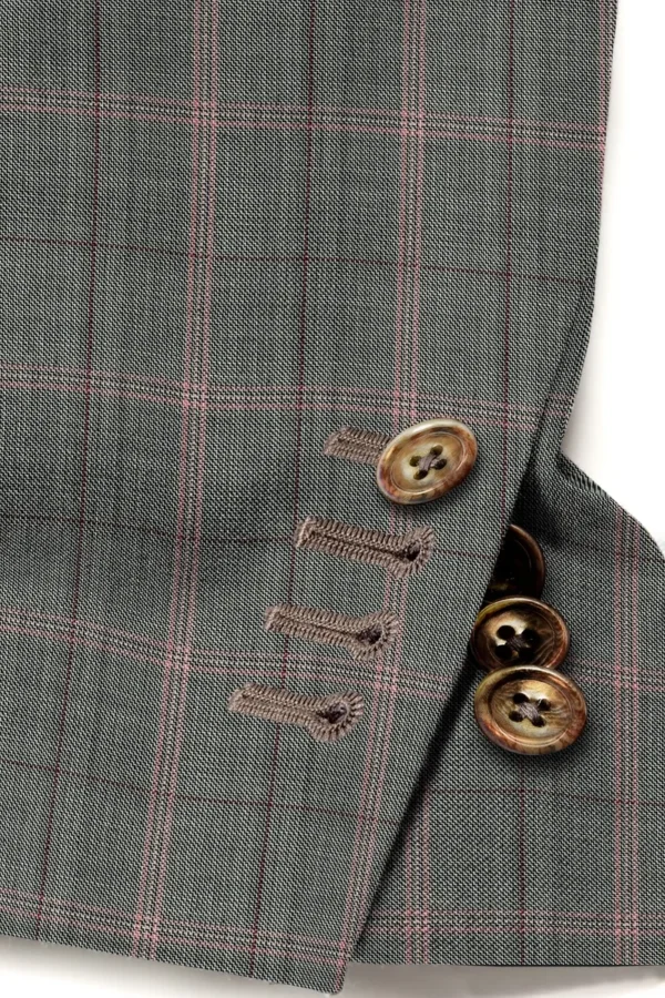 A close up of buttons on a suit jacket