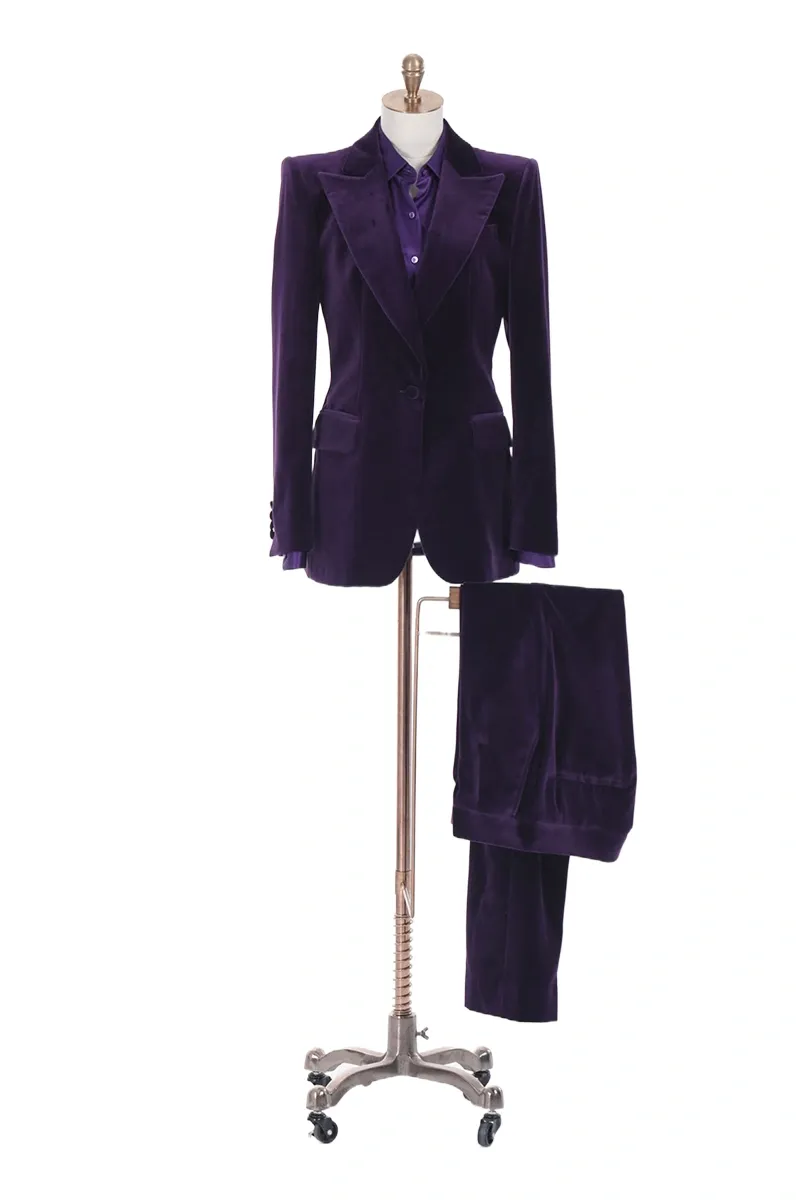 A purple suit on display in front of a white background.