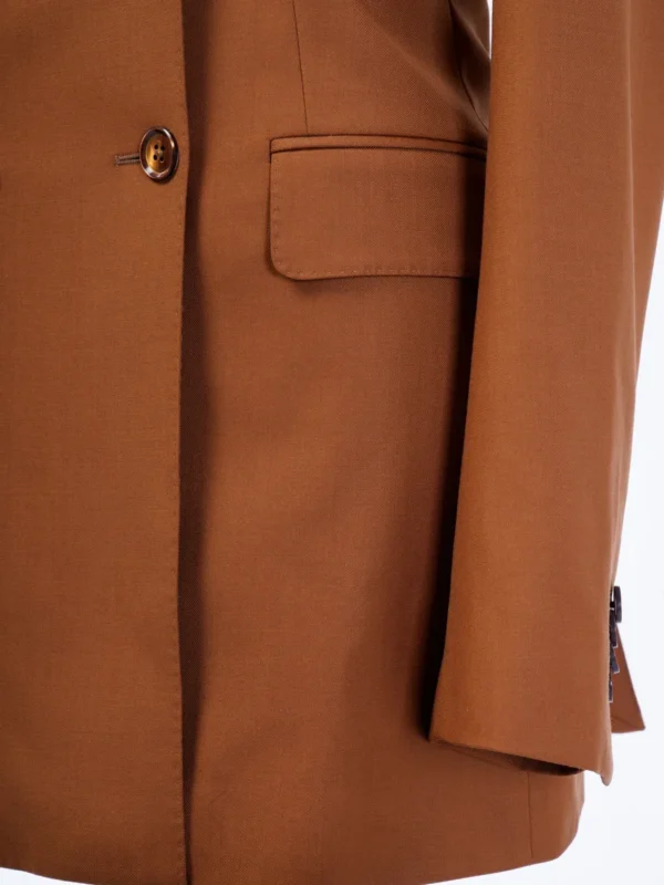 A close up of the pocket on a brown jacket