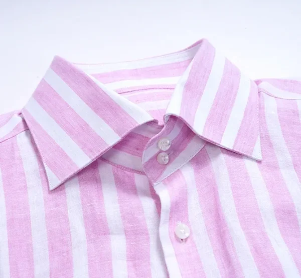 A close up of the collar and buttons on a shirt