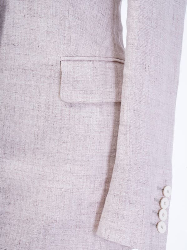 A close up of the pocket on a suit jacket