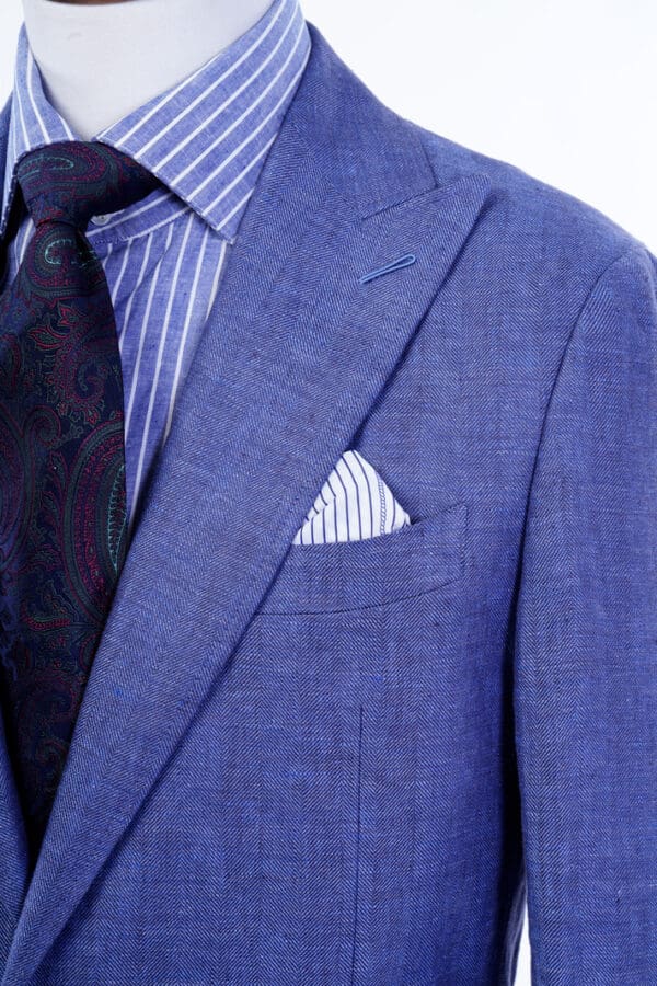 A close up of a person wearing a suit and tie