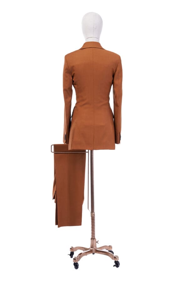 A brown suit with a skirt and pants