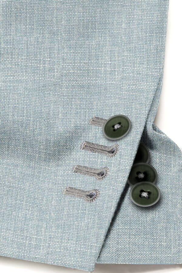 A close up of buttons on a suit jacket