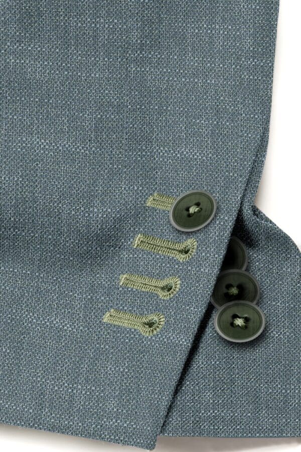 A close up of buttons on the sleeve of a suit