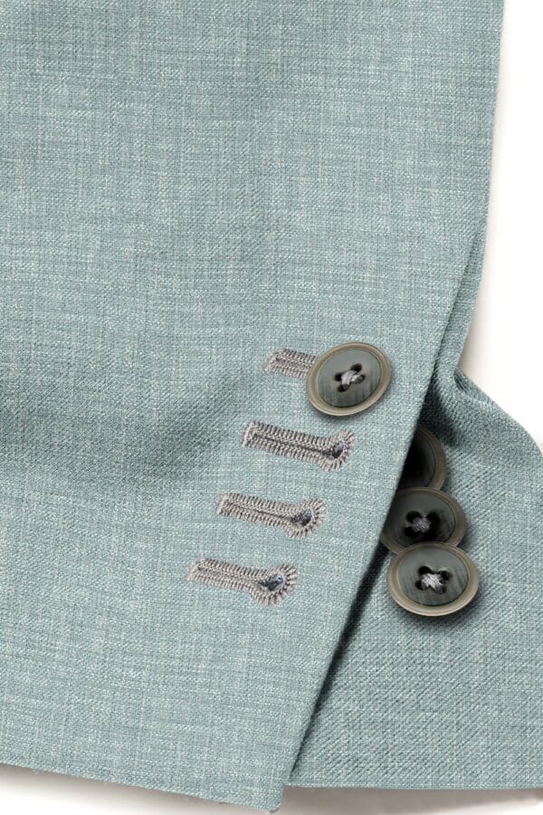 A close up of buttons on a suit jacket