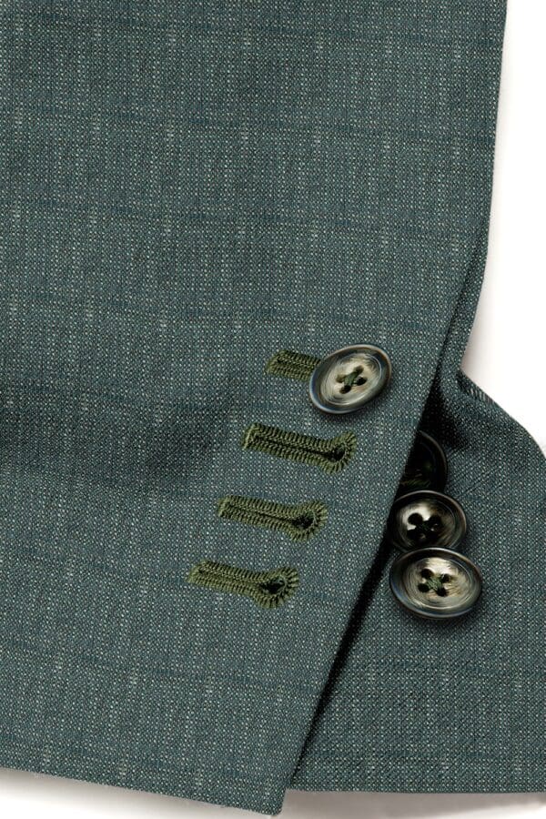 A close up of buttons on a suit jacket