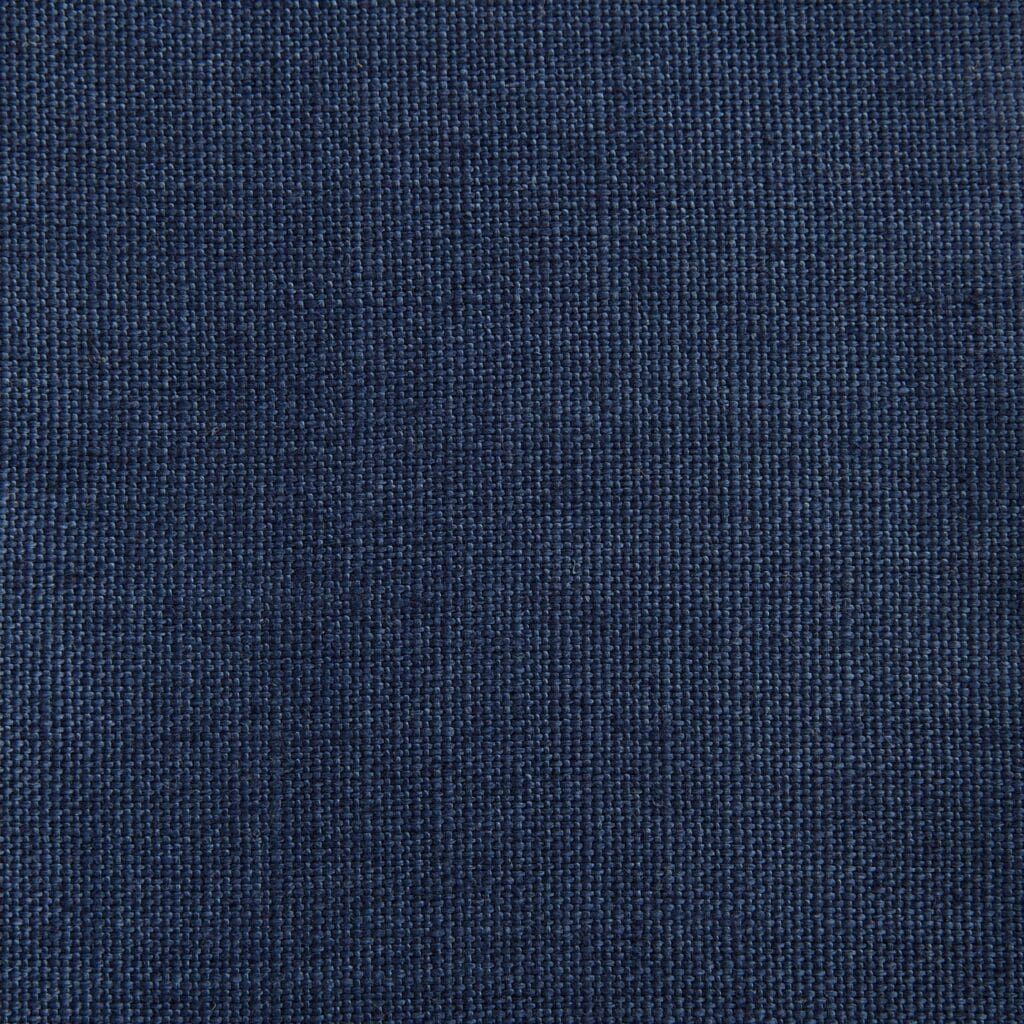 A close up of the fabric for a blue jacket.